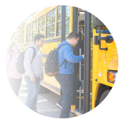 Young adult boarding a school bus