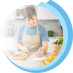 Young adult cooking and preparing food in the kitchen